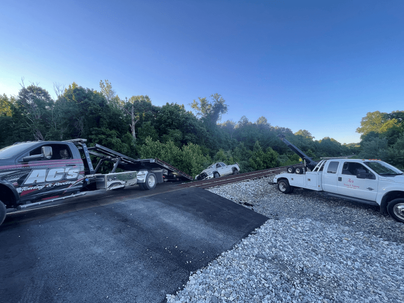 Vehicle recovery beside the railroad tracks