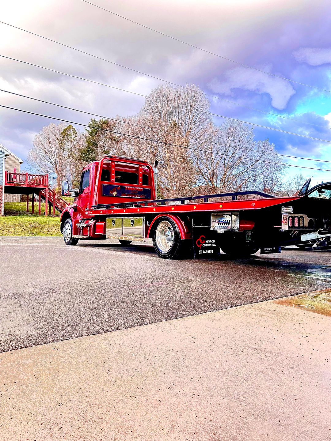 AC’s Towing truck on the road